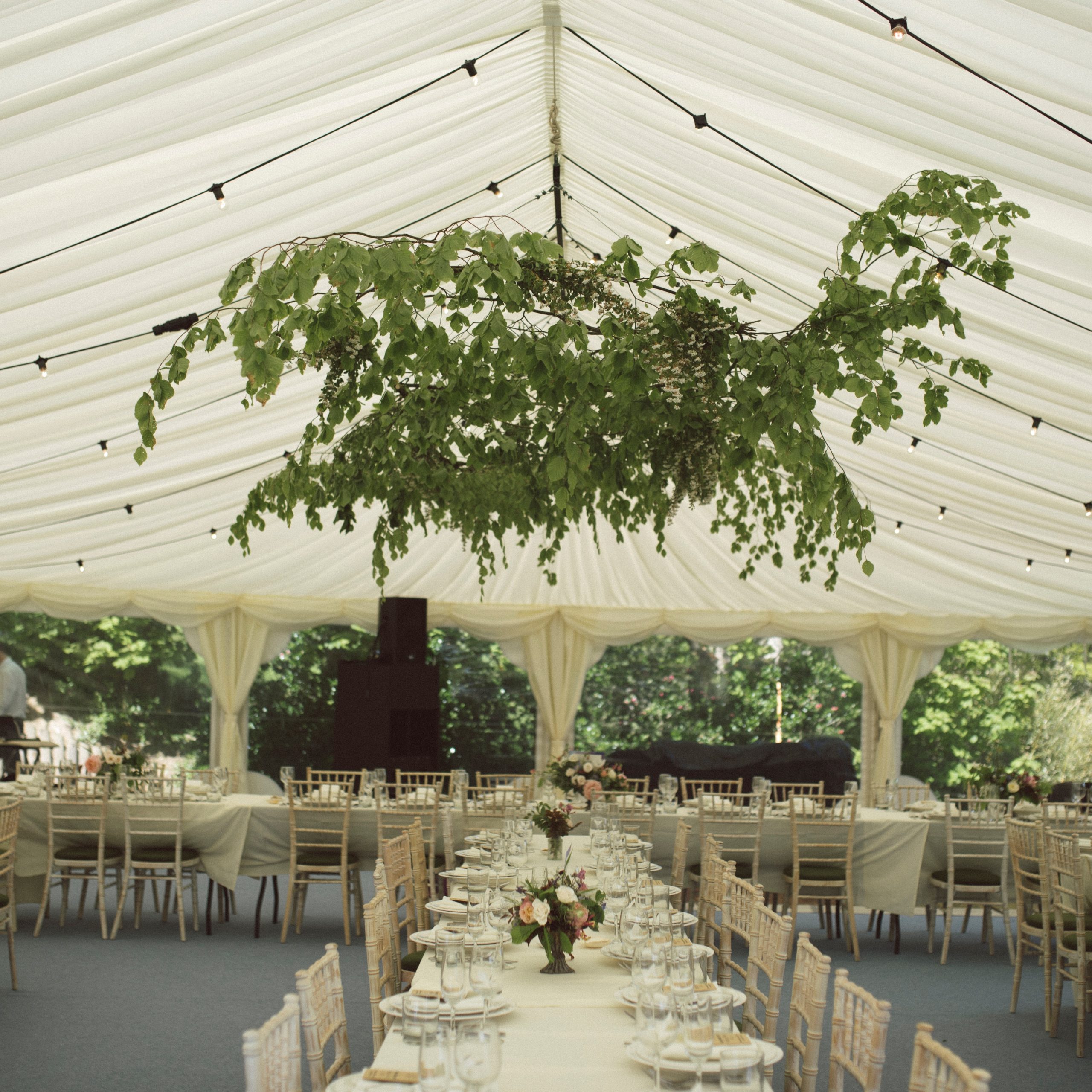Hanging florals at a marquee wedding in The Cotwolds