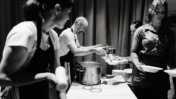 Queen and whippet kitchen team plating up